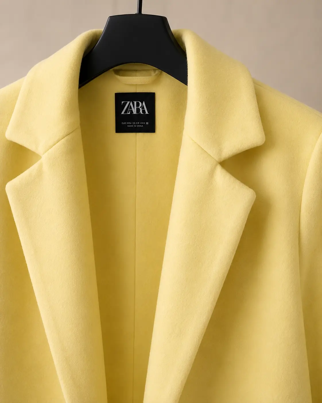 Relaxed notch lapel detail — ZARA butter yellow coat
