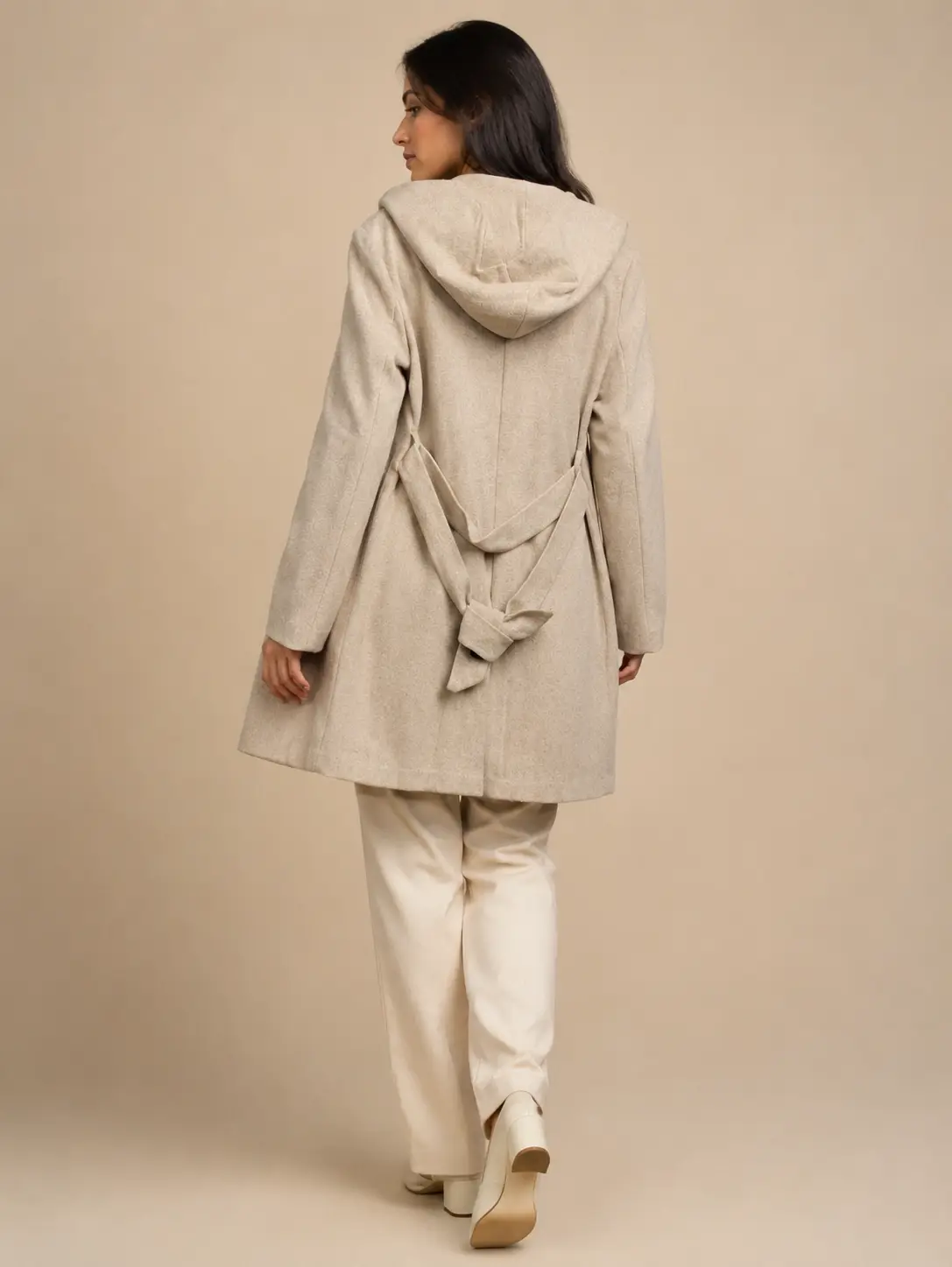 Model wearing ZARA oatmeal heather hooded coat — back belt detail
