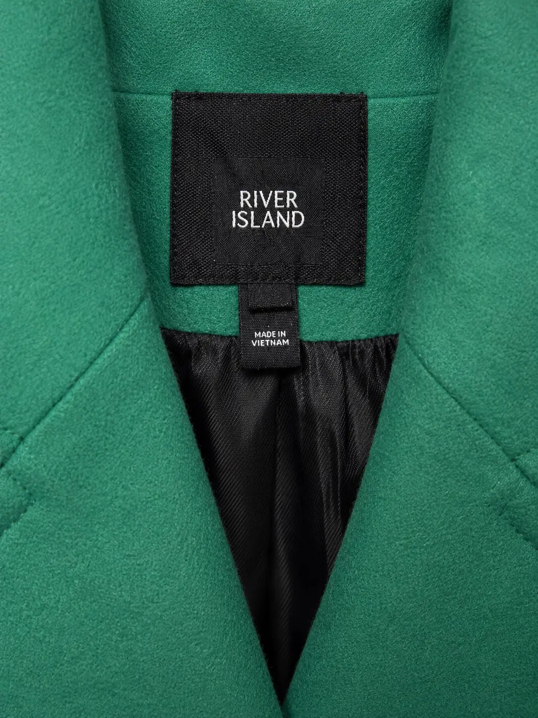 Construction detail of River Island Emerald Green Double-Breasted Coat