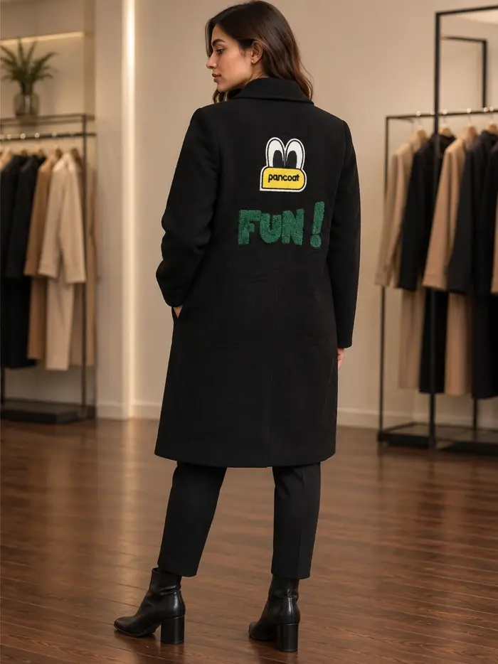 Model side view of Pancoat Black Embroidered Statement Overcoat