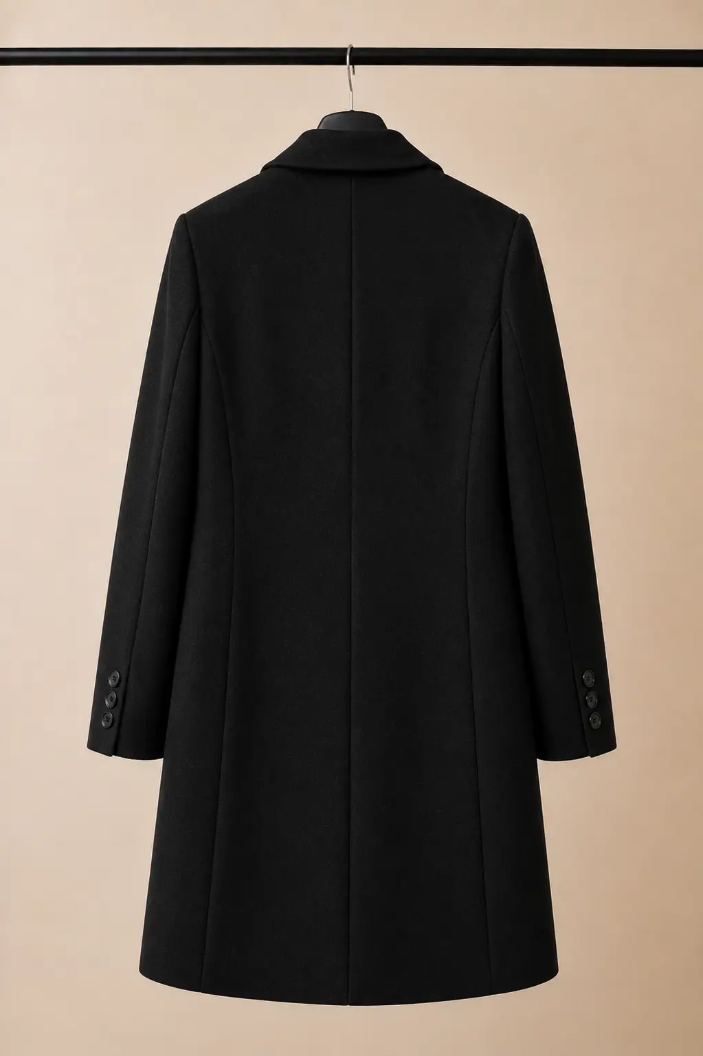 Back view of a Primark women's black tailored wool-blend coat showing structured shoulders, shaping seams and a clean straight hem at OXFITTER Pakistan.