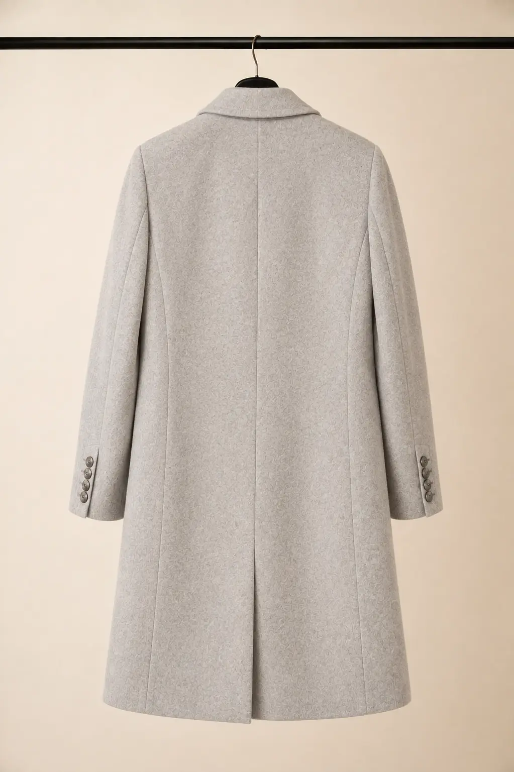 Back view of a Primark women's light heather grey tailored wool-blend coat showing structured shoulders, shaping seams and a clean tailored hem at OXFITTER Pakistan.