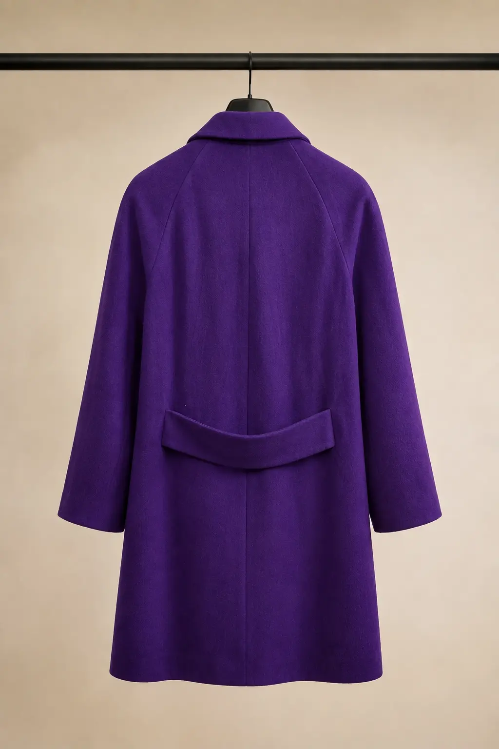 Back view showing the rear half-belt and longline shape.