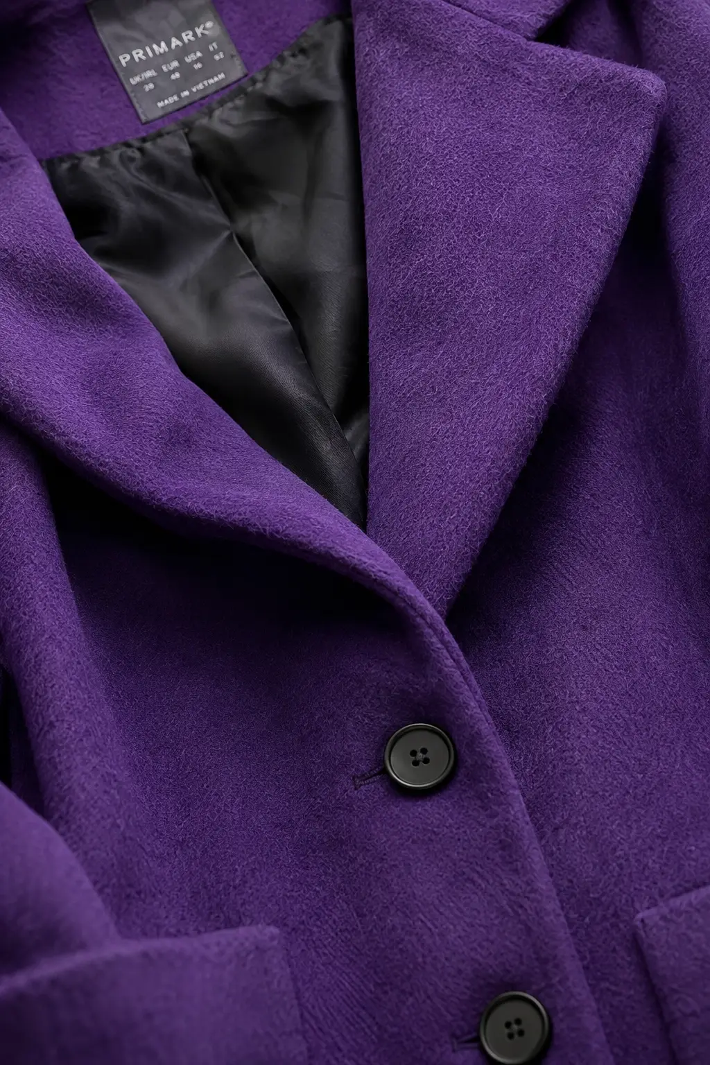 Close-up of the royal purple wool texture and construction.
